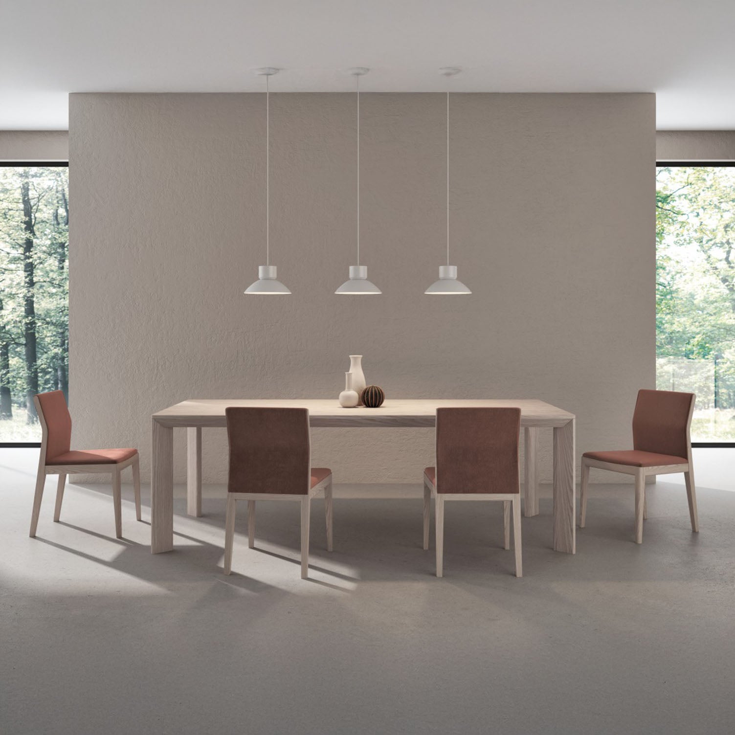 Dining area with a huppe furniture finley table and chairs in a modern interior setting.