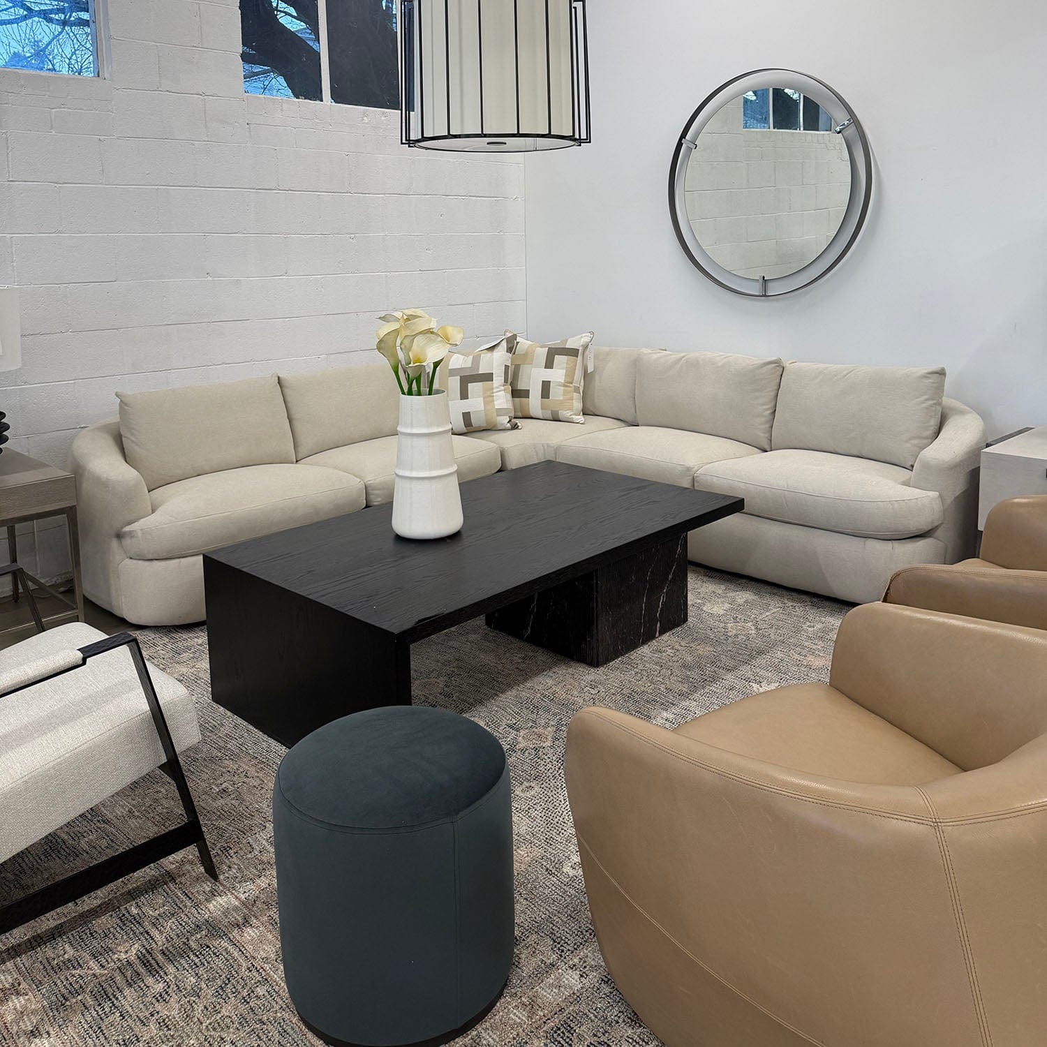 JULES SECTIONAL IN A LIVING ROOM SETTING WITH DARK COFFEE TABLE