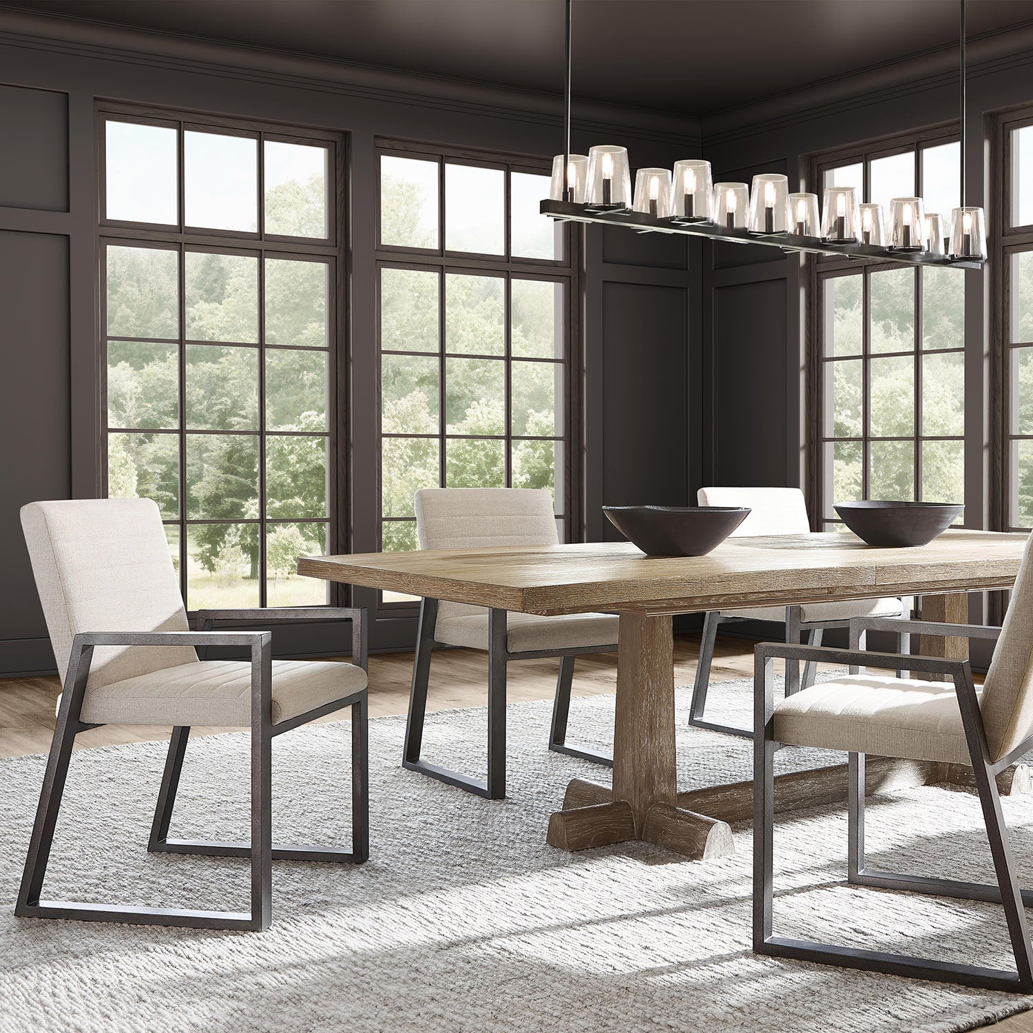 Dining room with Tribeca dining table from Bernhardt and modern chairs in a well-lit room.