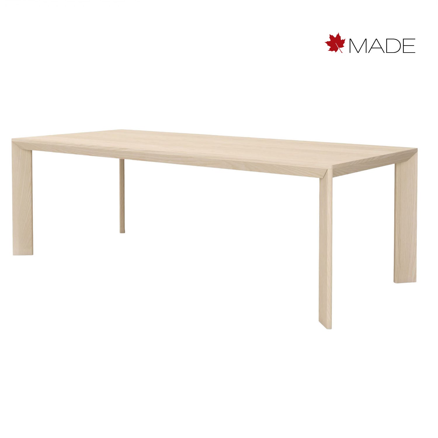 Light wood finley dining table on a white background with 'MADE' brand logo.