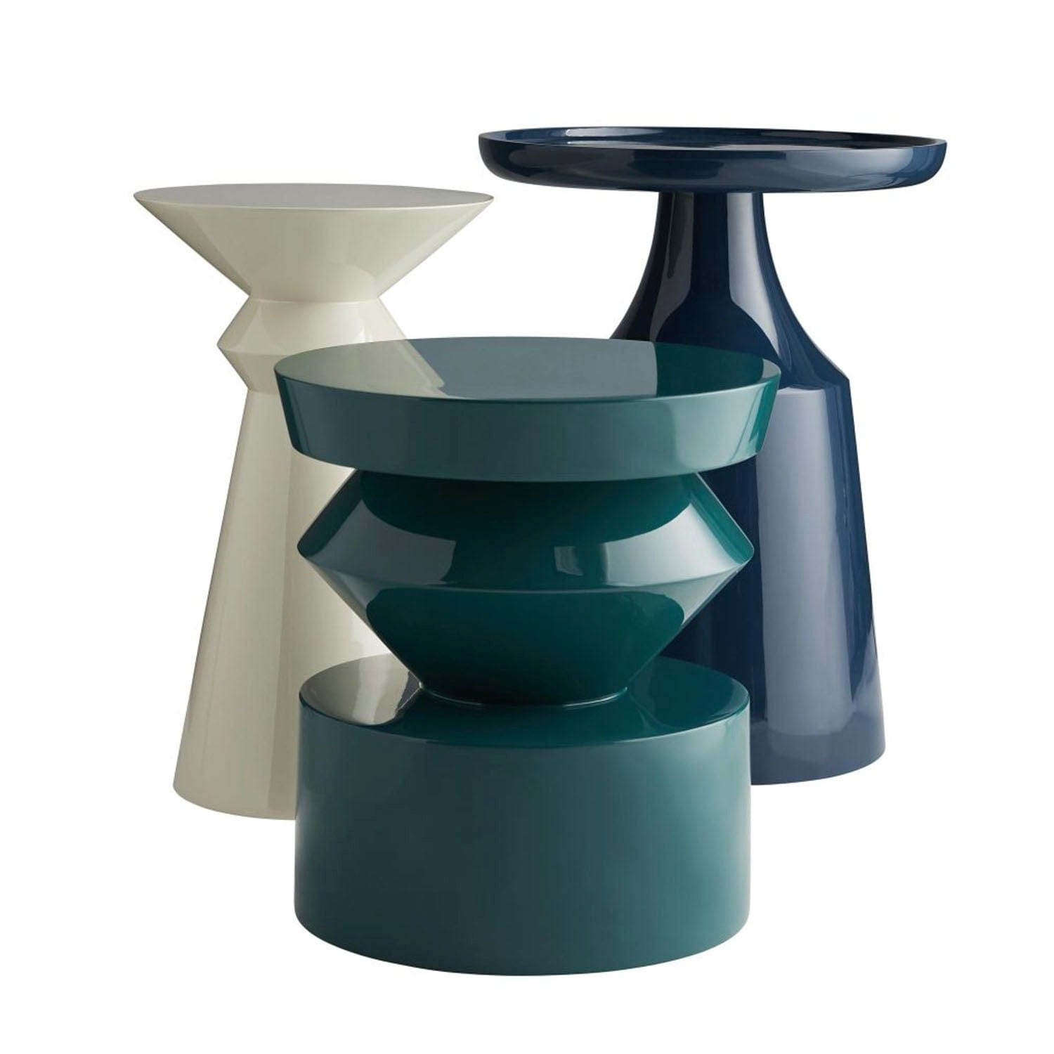 Set of three modern side tables in different colors on a white background